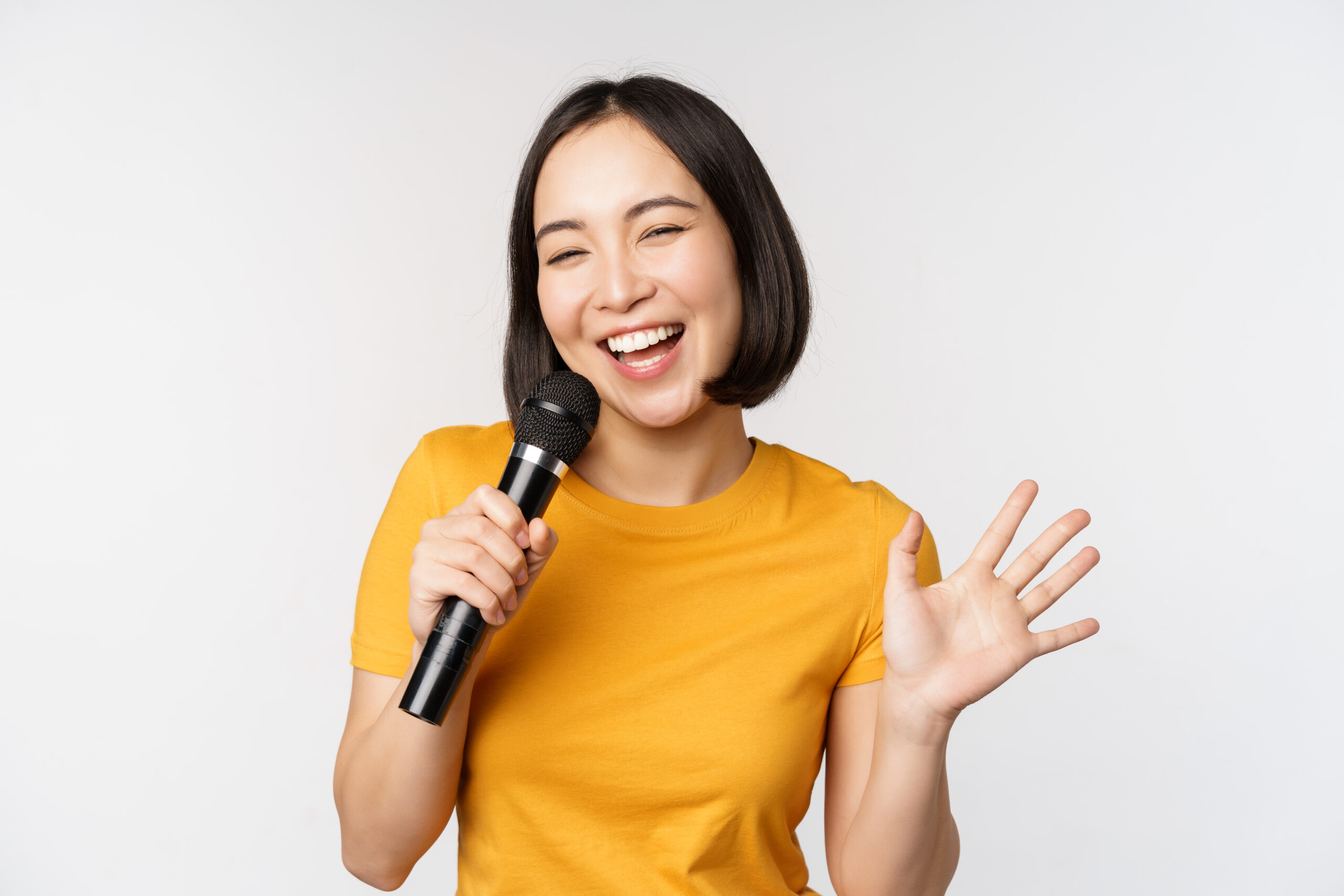 10 Mic Vokal Terbaik 2024 Happy Asian Girl Dancing Singing Karaoke Holding Microphone Hand Having Fun Standing White Background Scaled